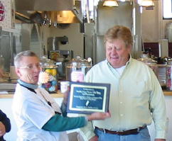 Beth presents plaque to Gene Romero